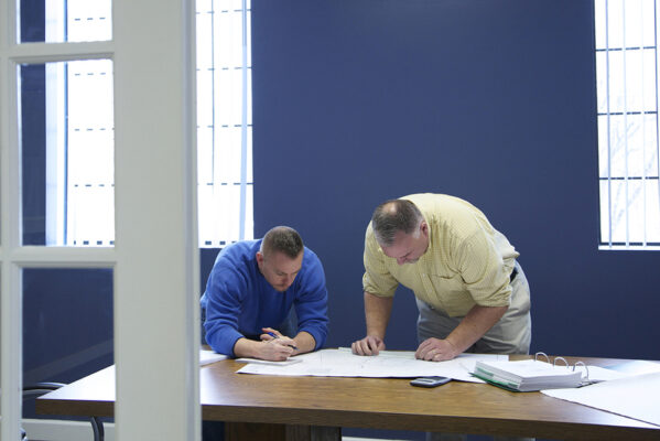 Two men strategizing at a table