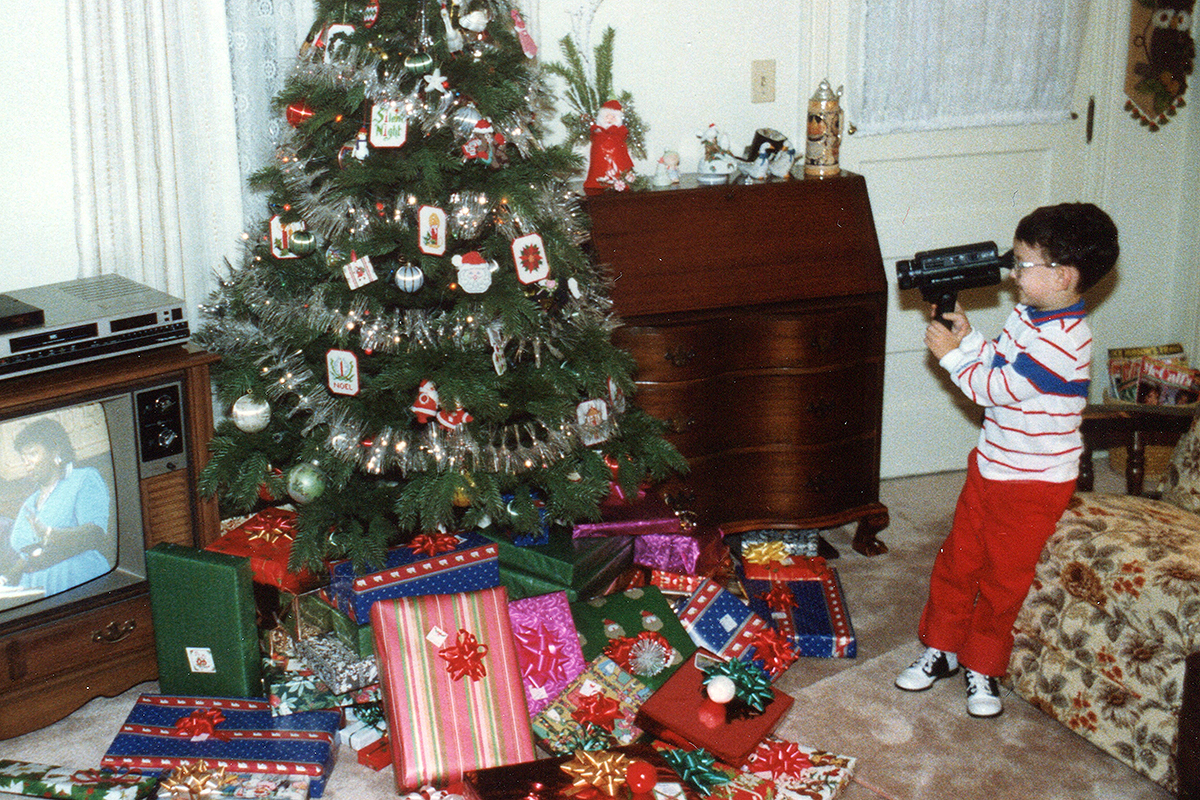 A boy recording a christmas tree
