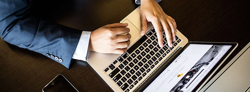 Person typing on a laptop