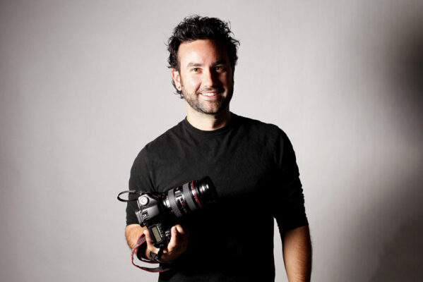 A photo of Brett Winter Lemon holding a camera