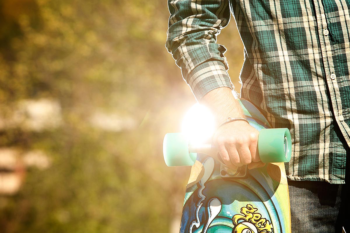 A man holding a skateboard