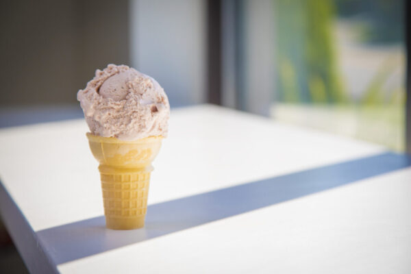 An ice cream cone on a table