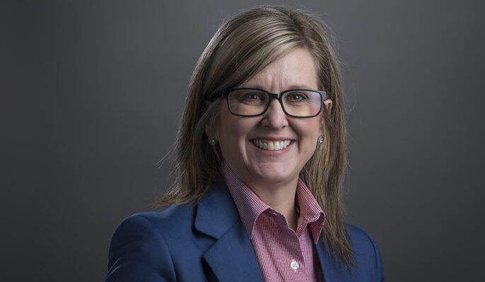 An executive portrait of a woman posing for a photo