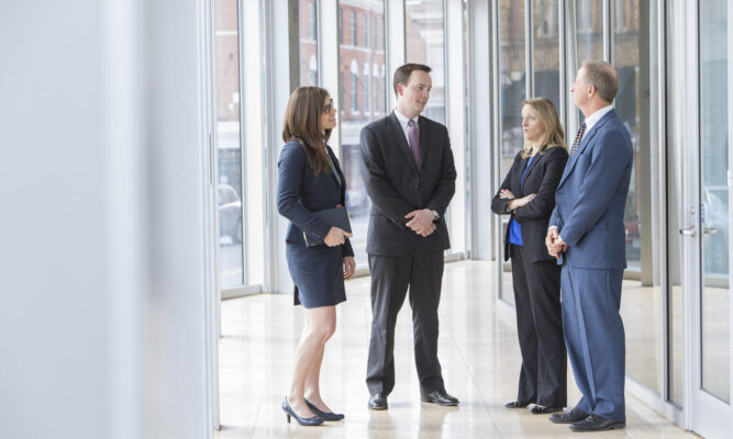 Dan Frith, Bo Frith, Lauren Ellerman, and Lauren Davis talking to one another