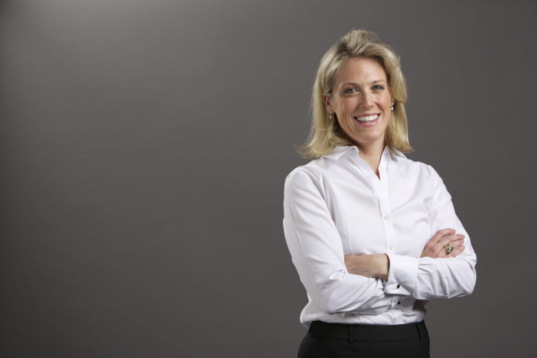 An executive photo of a woman smiling