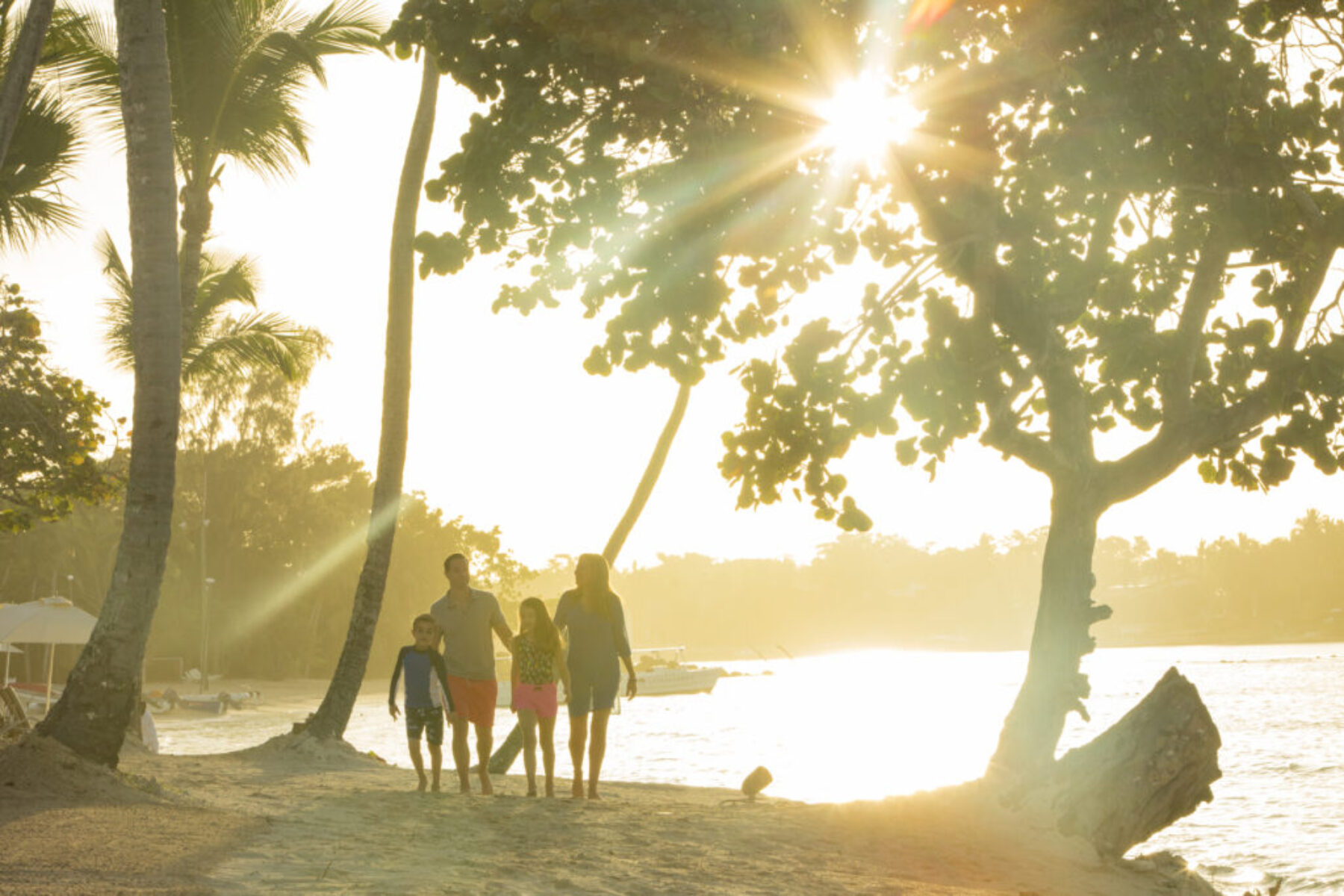 A family exploring near the water at Casa de Campo