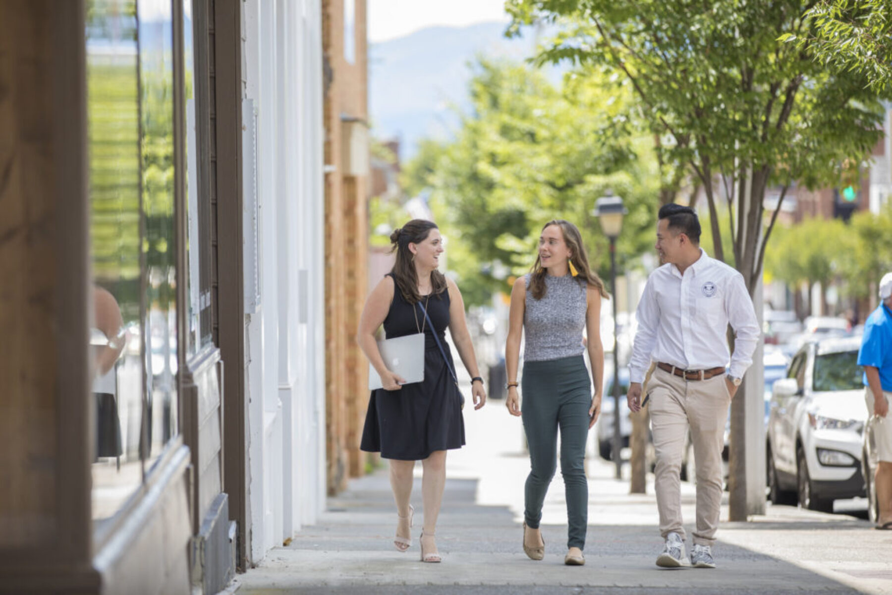 Sadie Remington, Khanh Ha, and Stephanie Chappelle walking and talking