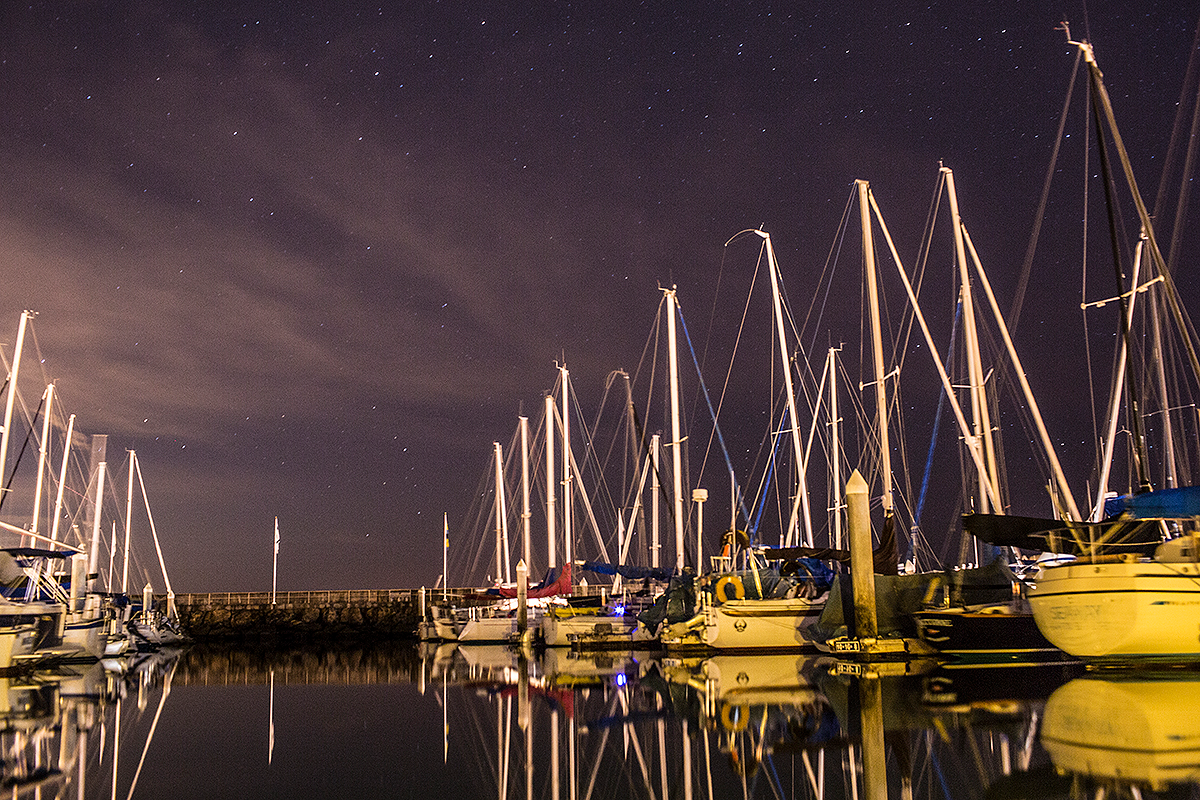 A night time view of docked boats