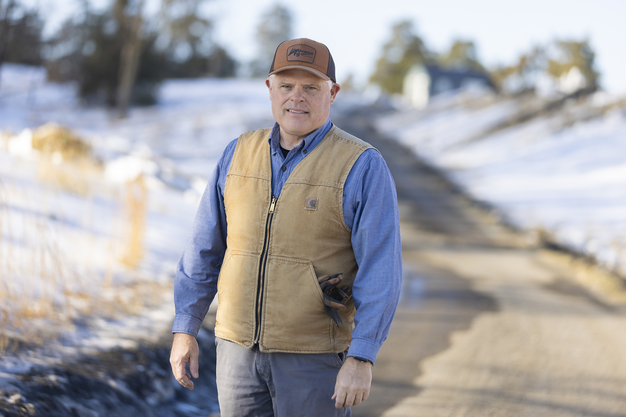 Chicken farmer posed for a portrait taken by Brett Winter Lemon.