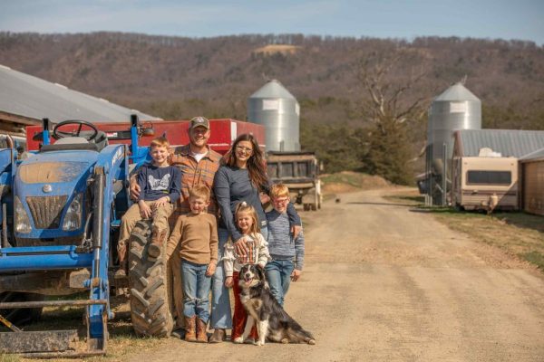 Farmer Focus family photographed beside a tractor on their Virginia farm.