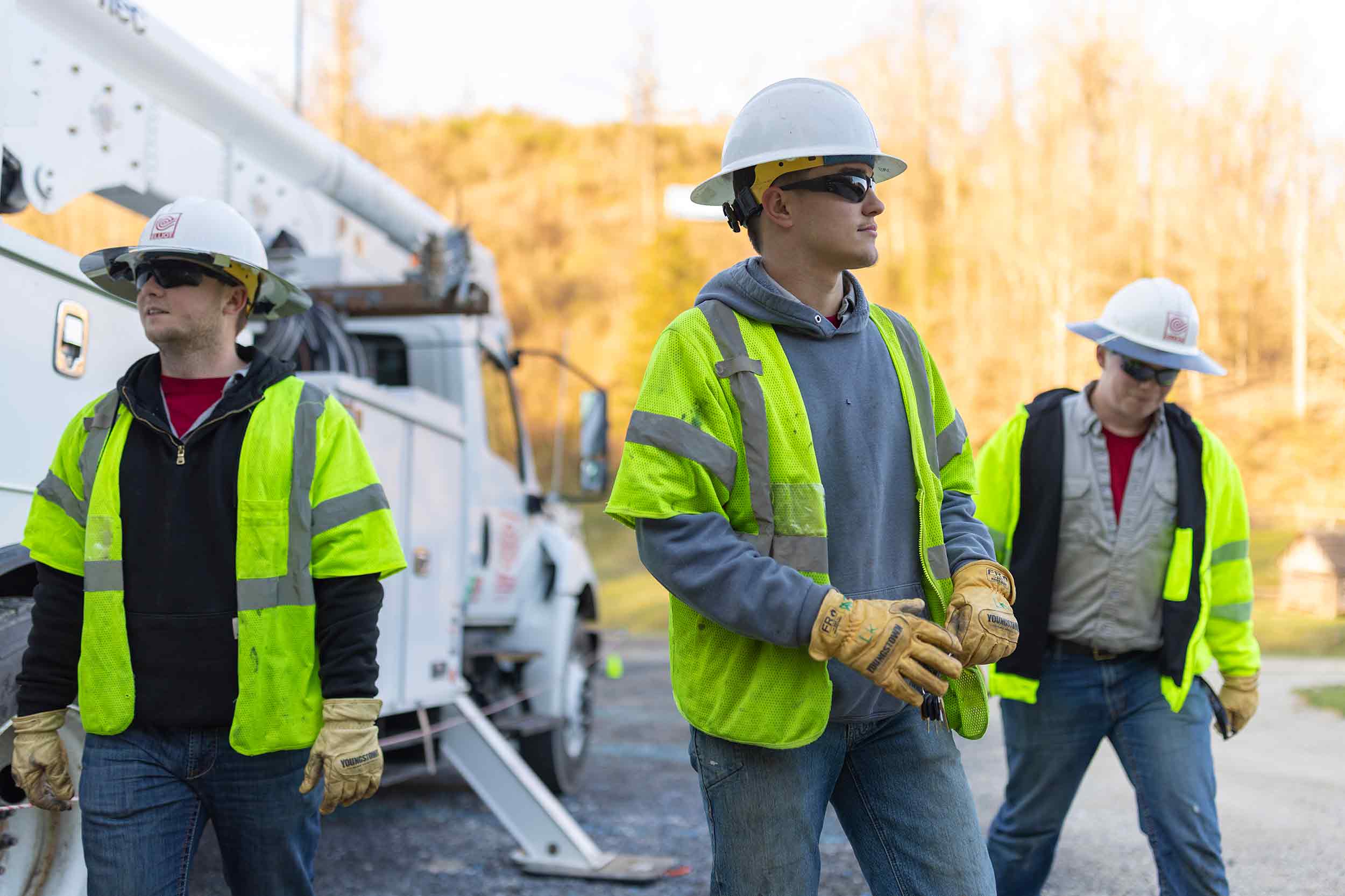 Utility workers in safety gear on location during a commercial photography shoot in Virginia.