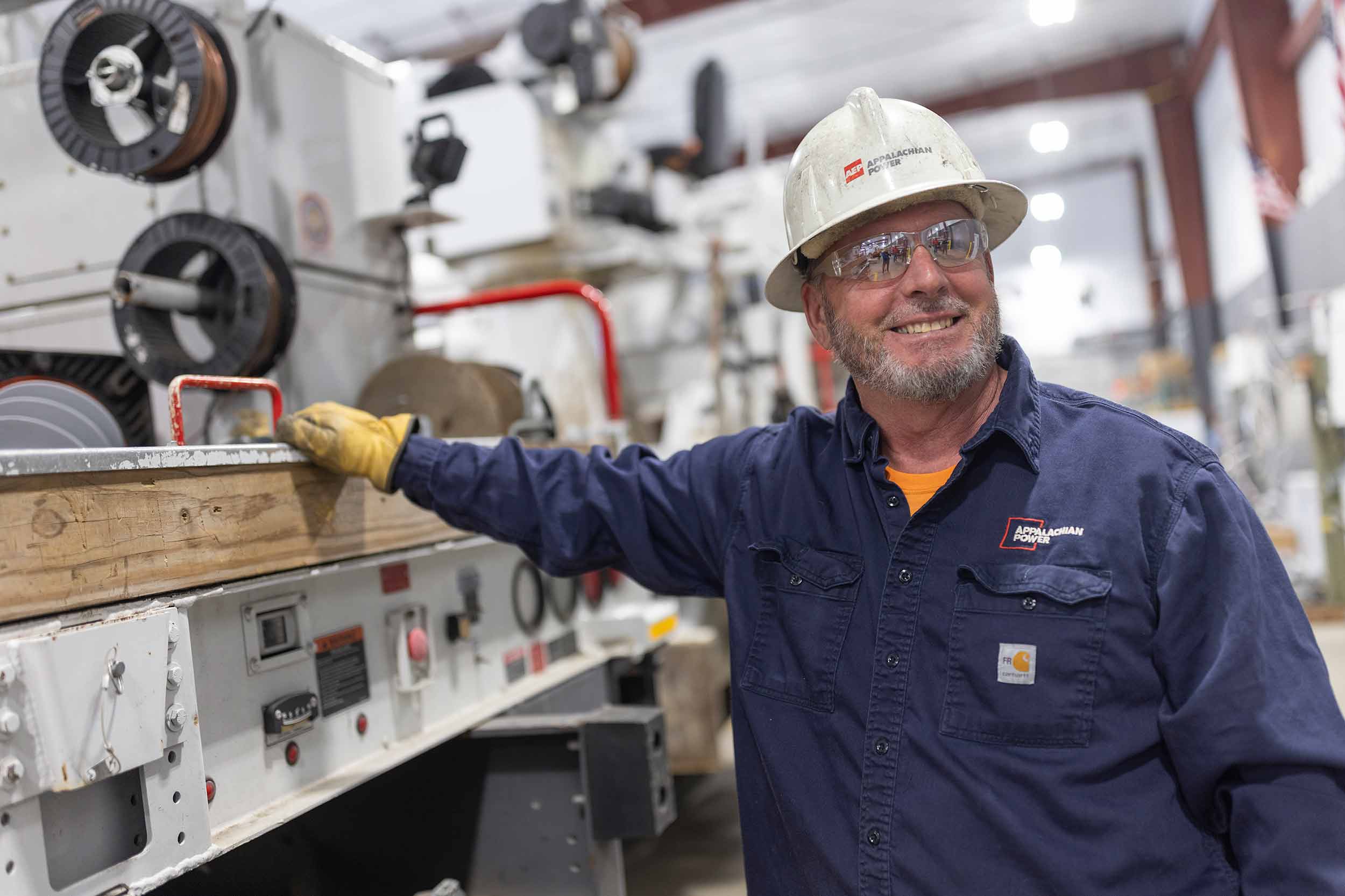 Appalachian Power employee photographed inside an industrial maintenance facility in Virginia by commercial photographer Brett Winter Lemon.